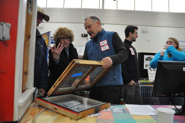 Chris Pratt demonstrating to LEAP energy fair attendees the Open Sash window retrofit system.